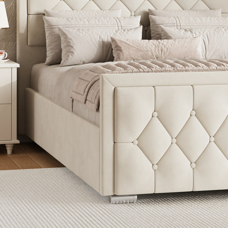 Beige velvet ottoman bed with a cross-puffed footboard placed near a white nightstand in a bedroom.