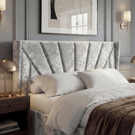 [Small Double | Silver] Silver crushed velvet wing headboard close shot, two white pillows below and brass lamp at side