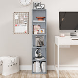 Tall grey narrow bookshelf beside a desk, perfect for organizing books and accessories in a modern workspace.