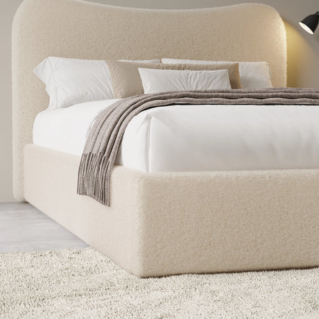 [Double | Beige] Closer view of headboard curve and bedding arrangement with textured boucle fabric visible