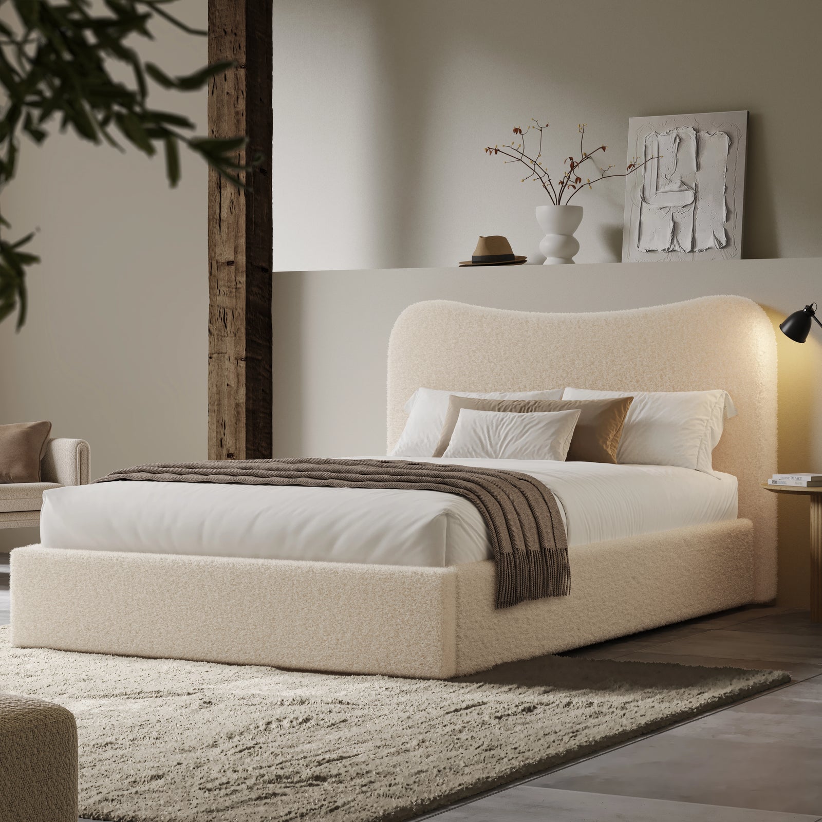 [Double | Beige] Wide angle of boucle ottoman bed in loft room with reclaimed timber beam and floating shelf with art