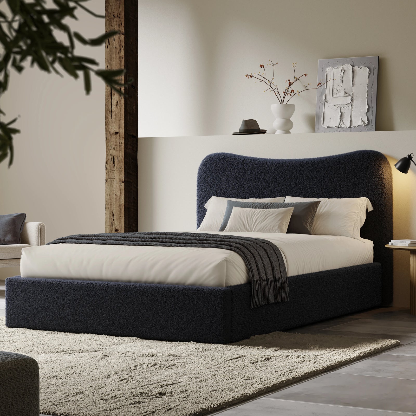 [King | Blue] Wide angle of dark blue boucle ottoman bed in loft room with reclaimed timber beam and floating shelf