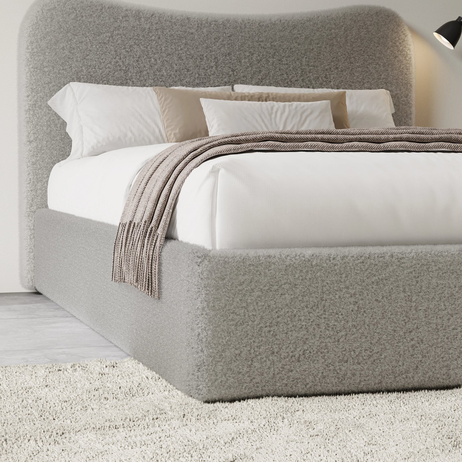 [King | Grey] Closer view of headboard curve and bedding arrangement with textured boucle fabric visible