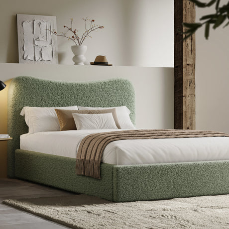 [King | Light Green] Curved headboard ottoman bed in loft-style room with exposed beam and cream shag rug on concrete floor