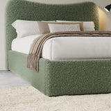[King | Sage Green] Closer view of headboard curve and bedding arrangement with textured boucle fabric visible