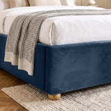 [Blue | Double] Close-up of plush upholstered base corner with rounded solid wood foot and soft curved edge