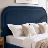 [Blue | King] Close-up of plush padded curved headboard with raised border piping that keeps its shape