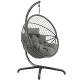 Grey cushion for hanging egg chair, sturdy base for indoor and outdoor comfort.