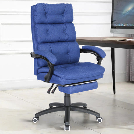 The dark blue linen comfortable desk chair in a modern home office with PC in the background.
