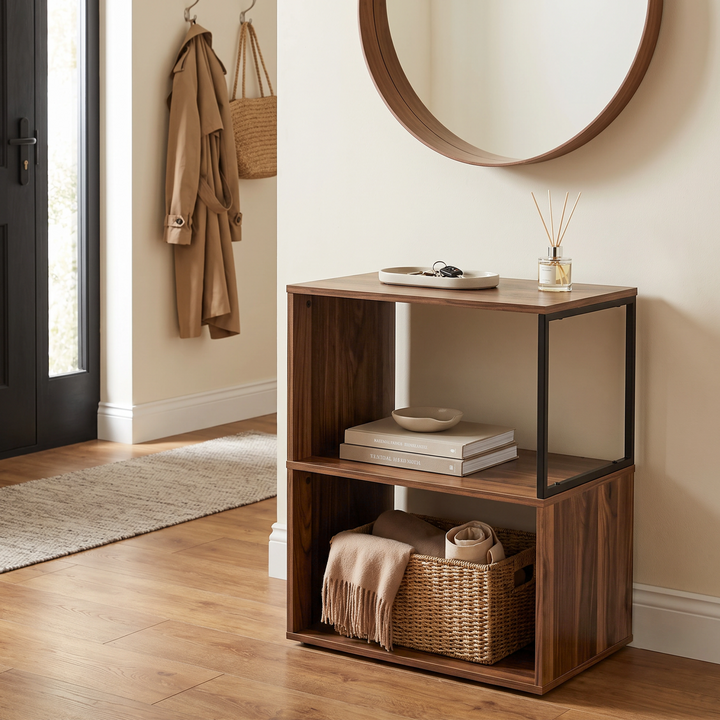 [Dark Bronx] This narrow side table stands in a hallway with keys, books and a basket arranged on its open shelves.