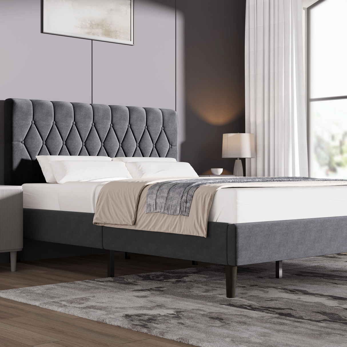 Grey velvet bed frame in king size with adjustable chesterfield headboard, set in a modern bedroom with neutral decor and wooden flooring.
