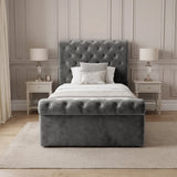 [Single | Dark Grey] Front view of the Chesterfield Single Ottoman Storage Bed Dark Grey Velvet showing the button-tufted footboard.