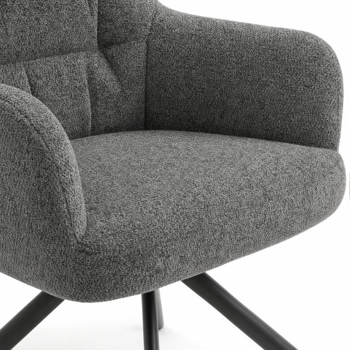 [Dark Grey | Set of 2] Dining chair close-up of boucle seat, rounded arm and stitched padded back, with black legs partly visible.