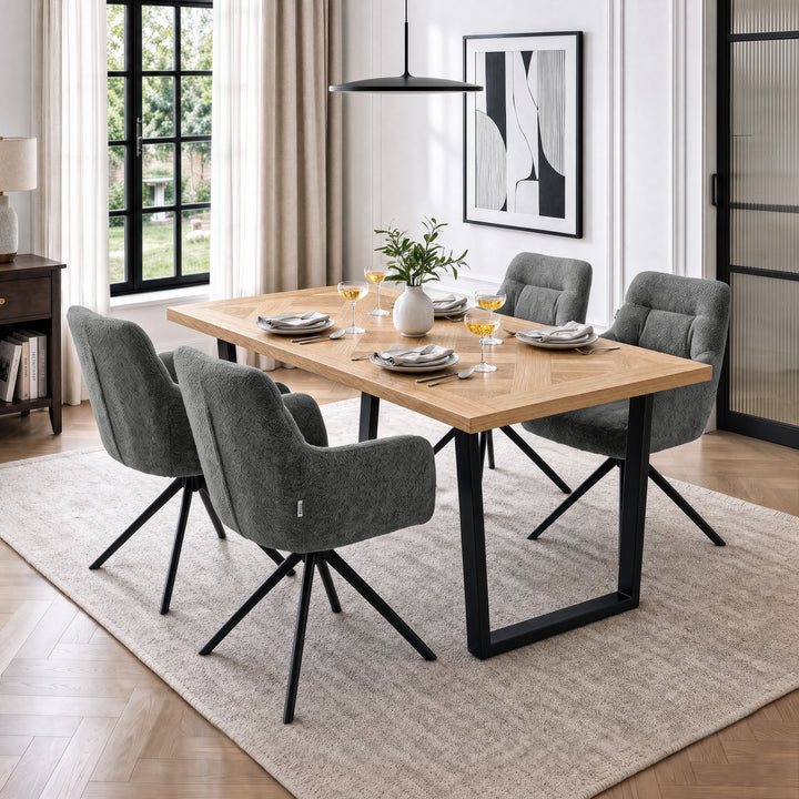[Dark Grey | Set of 2] Two pairs of swivel modern dining room chairs at a wood table styled with wine glasses and a white vase.
