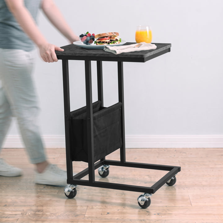 [Grey Marble] movable side table being rolled on caster wheels with snacks and drink on tabletop