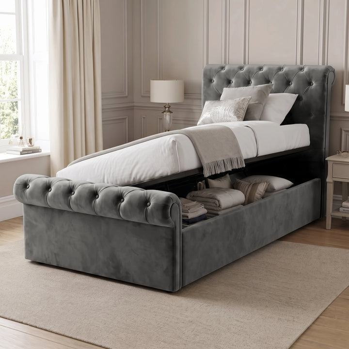[Single | Dark Grey] Hydraulic lift mechanism raised to reveal under-bed storage space on the Chesterfield Single Ottoman Storage Bed.
