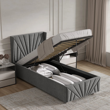 Grey upholstered bed with storage compartments in a bedroom setting.