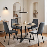[Dark Grey | Set of 4] Velvet dining chairs around a round table, showing tufted cushions, curved backs and black metal legs.