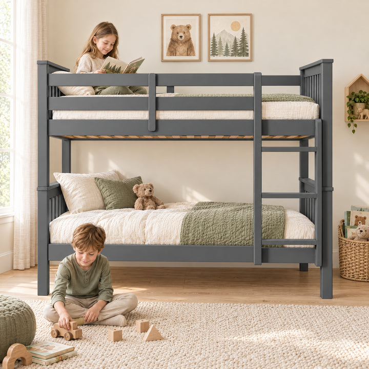 [Dark  Grey] Bedroom showing a child reading on the top bunk, another playing on a rug, bedding, guard rails, and ladder.