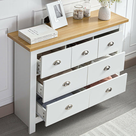 Designer chest of drawers uk with white body and wooden top, featuring multiple open drawers.