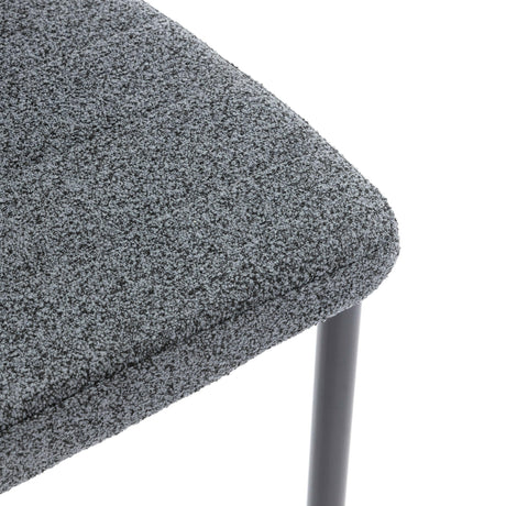 Close-up of dining chair sale set of 4 with grey textured upholstery and black metal legs