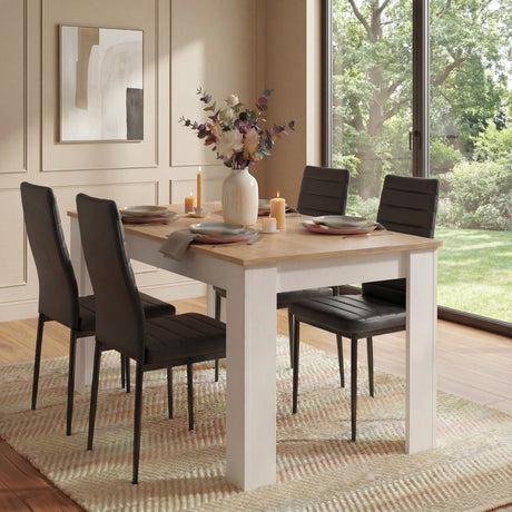 [4 Seater | Black] lifestyle of 4 seater dining set, white pine table and four black PU leather chairs, vase on top