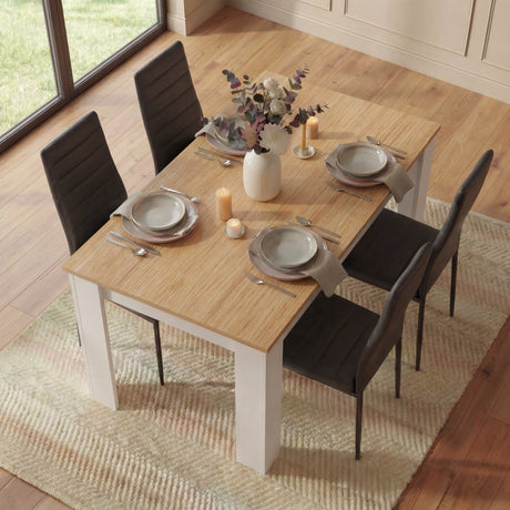 [4 Seater | Black] 4 seater dining set scene: white pine base table, oak top, four black PU chairs, vase centre