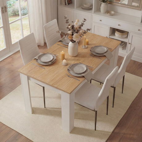 [4 Seater | White] white pine four chair dining set styled with place settings near tall white display unit