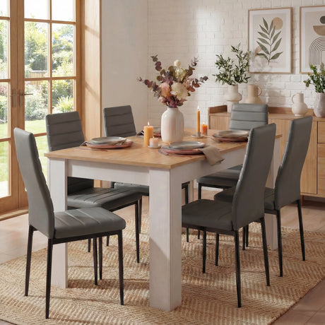 [6 Seater | Grey] six seater dining set: oak topped white frame table and six grey tall-back chairs, plant beside