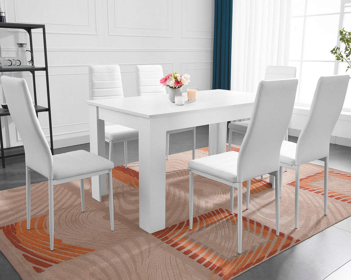 White dining table and chairs set for a sleek and modern dining room style.