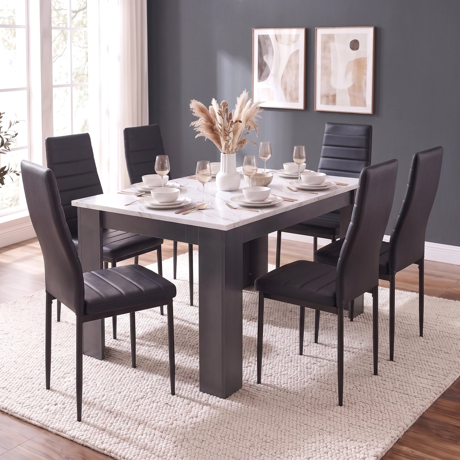 [6 Seater | Black] dining room set featuring a rectangular grey table with a white marble-look top and six black upholstered chairs, styled on a textured cream rug in a bright room with a dark gray wall.