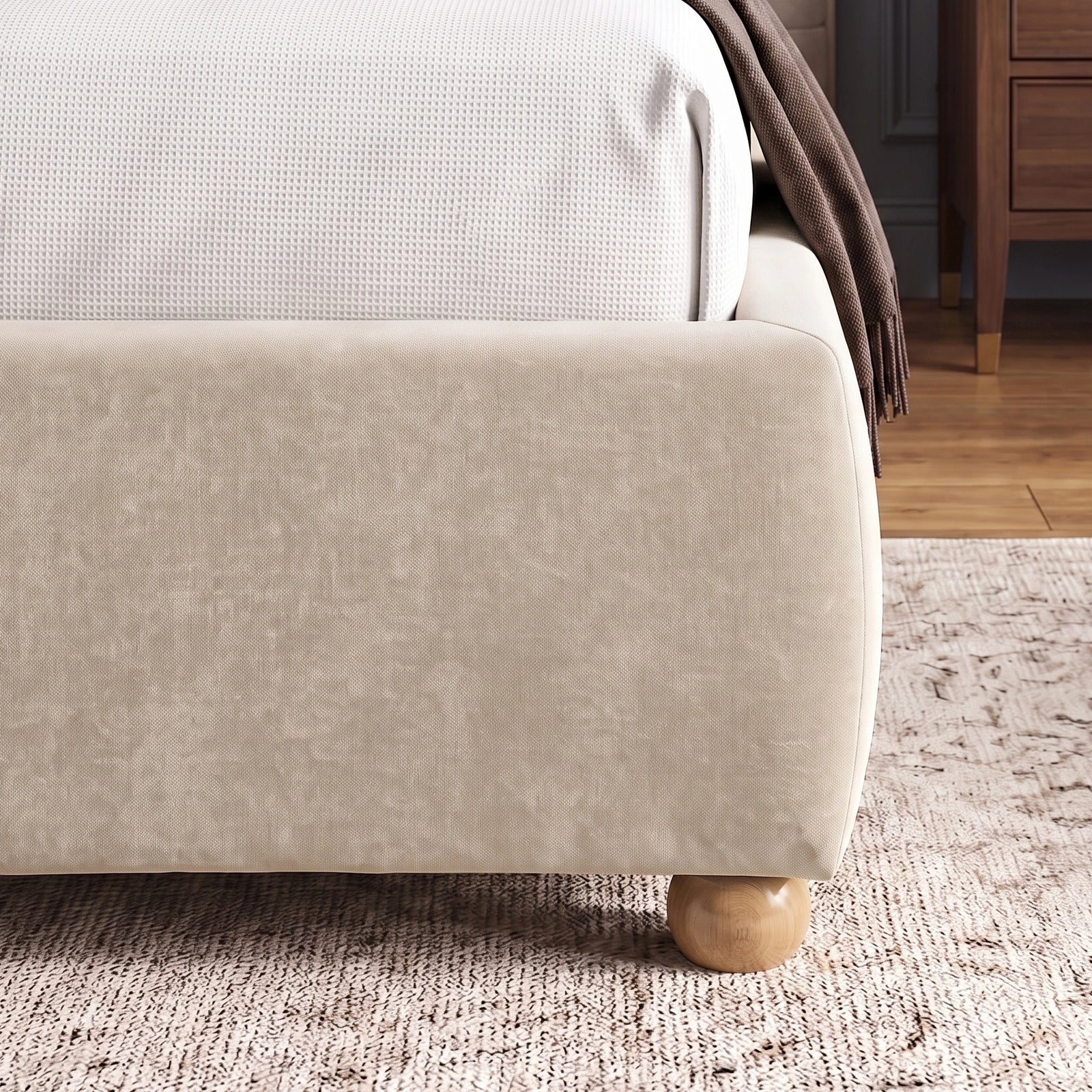 [Double | Beige] Corner side detail of beige bed frame emphasizing soft fabric texture of footboard and wooden legs