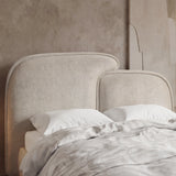 [Double | Beige] Close-up of beige split headboard with stitched upholstery and gently curved upper edge of double bed frame