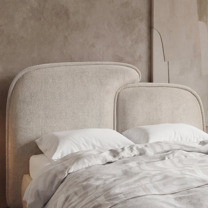 [Double | Beige] Close-up of beige split headboard with stitched upholstery and gently curved upper edge of double bed frame