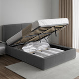 Corduroy ribbed velvet upholstered ottoman bed frame with end lift storage in dark grey, shown with mattress lifted to reveal bedding storage.