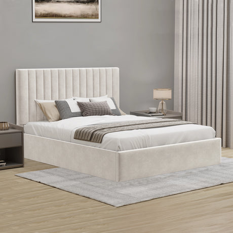 Beige upholstered bed in a bedroom setting with a lamp and curtains.