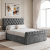 [Double | Dark Grey] Angled bedroom view with tufted headboard, rolled footboard, bedside table, wall art, and tall window