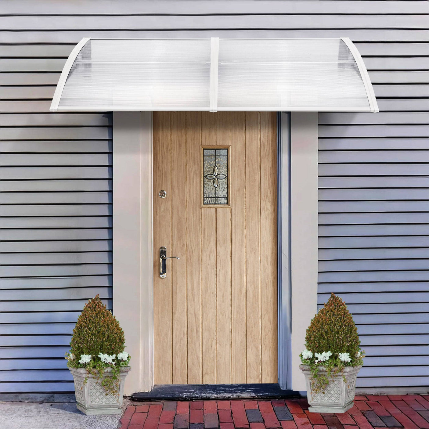 Modern double door canopy UK with clear polycarbonate panels and white brackets.