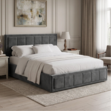 [Double | Grey] upholstered bed frame with a tufted headboard and footboard, dressed in white bedding, set in a styled bedroom with nightstands, lamps, curtains, and a framed painting.