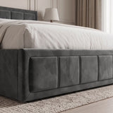 [Double | Grey] upholstered bed frame with a padded headboard and tufted side panels, shown with white bedding in a softly lit bedroom setting.