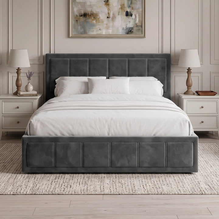 [Double | Grey] Symmetrical front view of velvet ottoman storage bed flanked by twin nightstands and lamps
