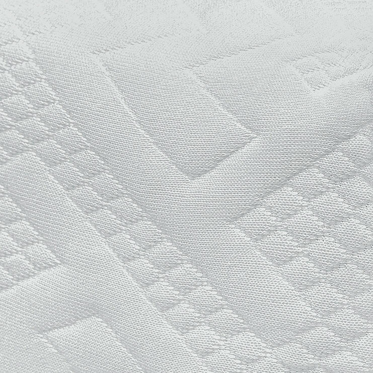 Textured close-up view of a double small mattress fabric design with intricate patterns.