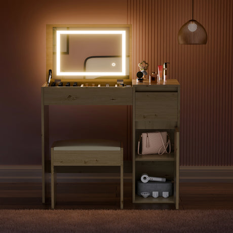 Wooden vanity with illuminated mirror, chair, and various items in a dimly lit room.