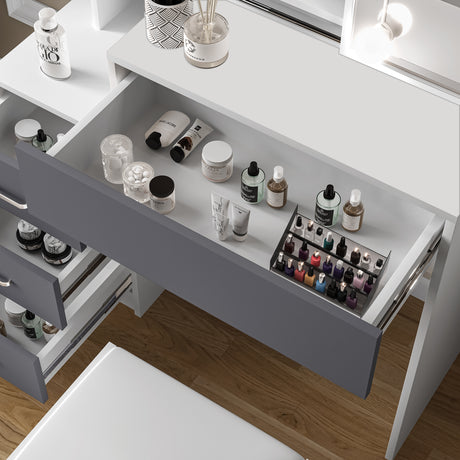 Dressing table with drawers, mirror, and built-in lights for a stylish and functional setup.