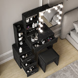 Large black dressing table with mirror drawers and stool, multiple drawers, and marble finish.