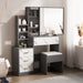 Dressing Table with Storage, Drawers and Mirror - Vanity Makeup Table in grey and white finish with marble accents, cushioned stool, and shelving.