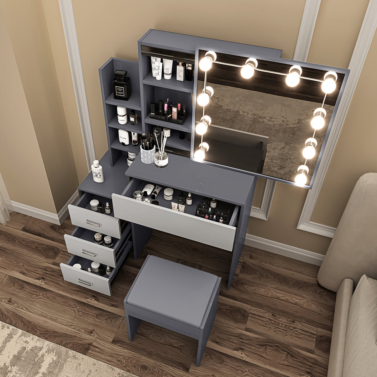 Dressing tables with mirrors and lights, grey drawers, shelves, and stool for organized storage.