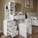 White modern dressing table with drawers and mirror in a stylish bedroom setup.