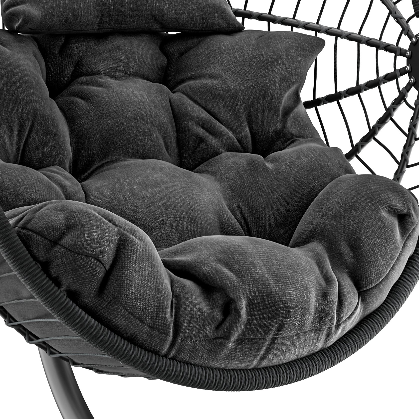 Egg chair hanging with plush black cushions and durable woven frame for comfort.