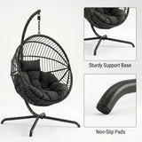 [Black] hanging chair with cushioned seat on a white background, featuring sturdiness and non-slip pad details